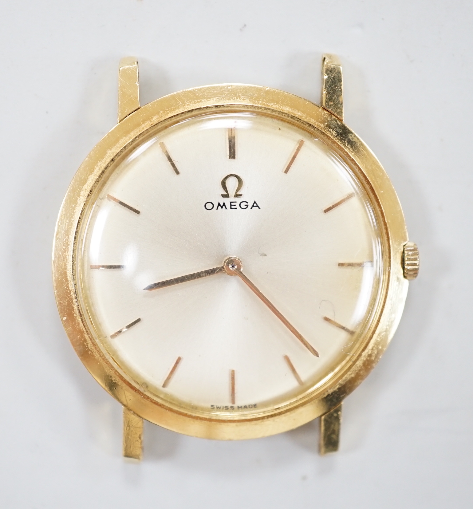 A gentleman's yellow metal Omega manual wind dress wrist watch, no strap, box or papers, case diameter 32mm.